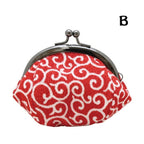 Red Ryukodo fabric coin purse featuring white traditional arabesque design and ball clasp