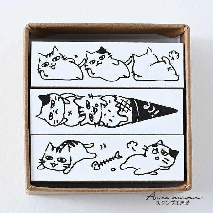 Lazy cat border stamp designs on rubber faces inside kraft box
