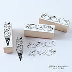 Sanby lazy cat border stamps with black ink impressions on paper