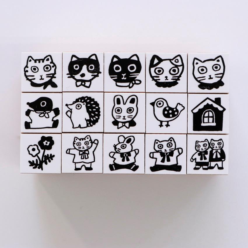 Set of twelve Sanby wooden chibi stamps with cats, hedgehog, and flowers