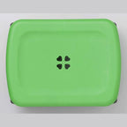 Lime green Shimomura Kihan garden stool with clover motif seat and black wheels