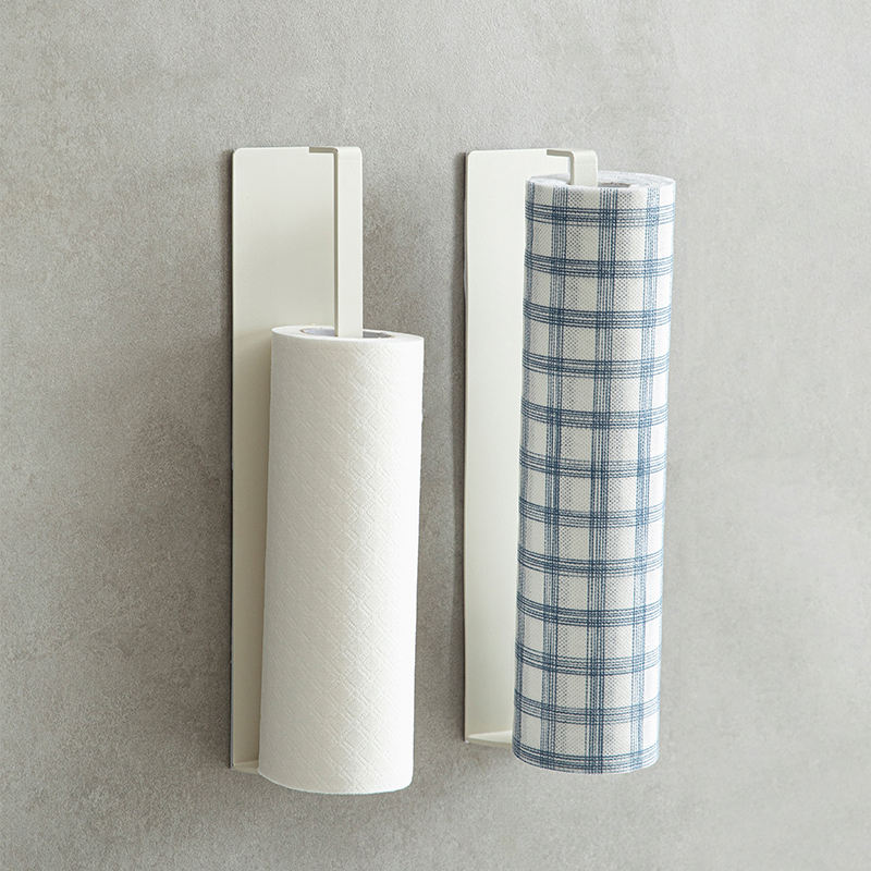White Shimoyama adhesive paper towel holder holding two rolls on gray wall