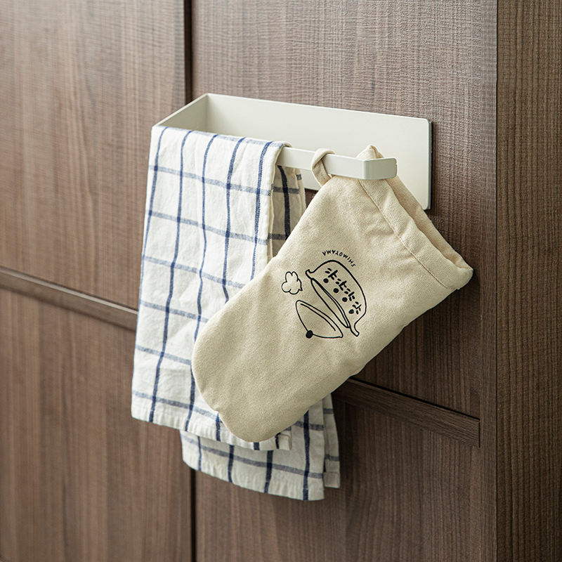 Versatile white Shimoyama wall mount holding checkered cloth and oven mitt on cabinet