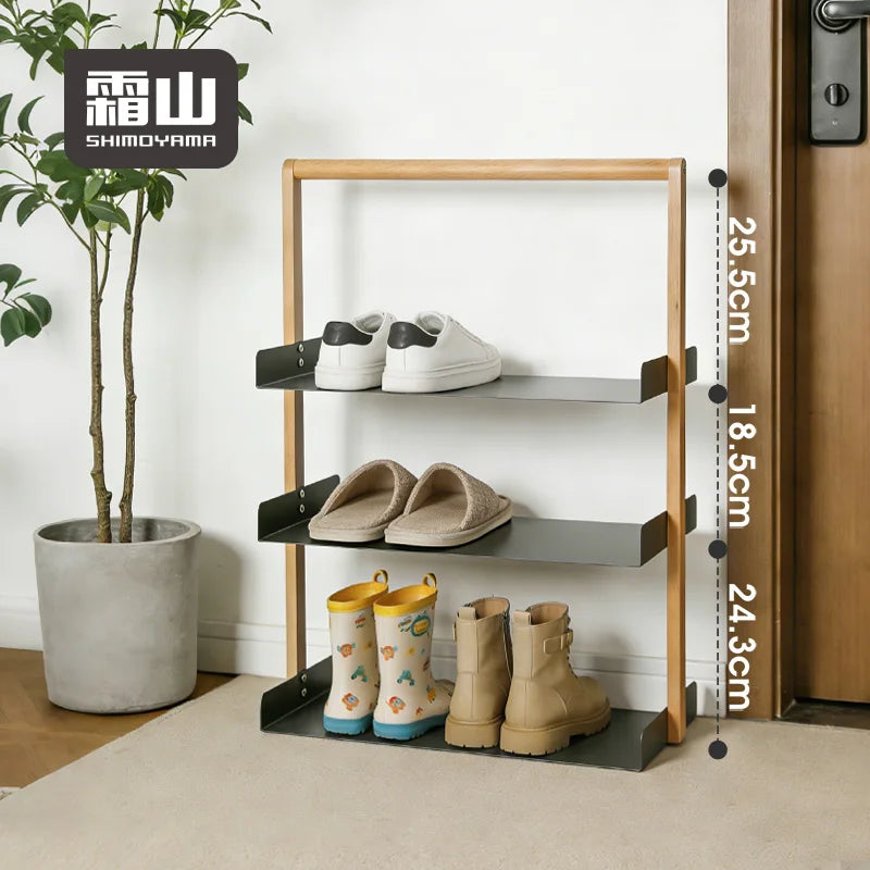 Front view of three-tier shoe rack displaying vertical shelf dimensions for sneakers, slippers, and children's boots