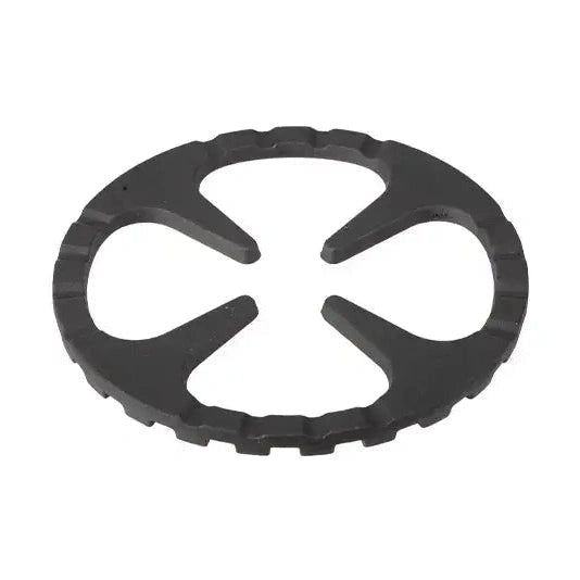Top-down view of circular Shimoyama cast iron trivet with curved openings