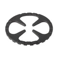 Top-down view of circular Shimoyama cast iron trivet with curved openings
