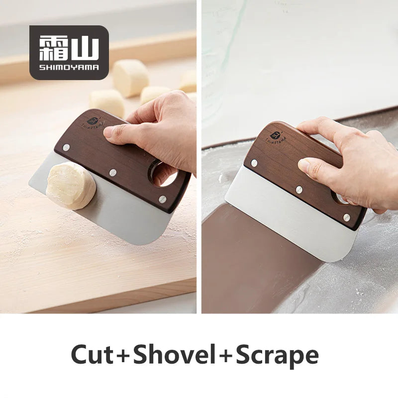 Shimoyama dough scraper lifting and scraping dough on wooden board demonstrating cut shovel and scrape functions