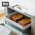 Enamel prep tray used for toasting bread in oven