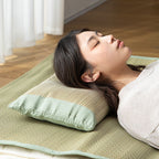 Person sleeping on side using beige rush straw pillow with green cotton borders