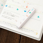 Totonofu Planner Stamps Joys of the Four Seasons stick lying on an open planner
