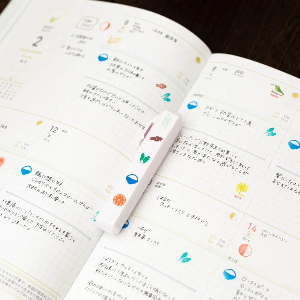 Totonofu Planner Stamps Seasonal Foods stick lying on an open planner