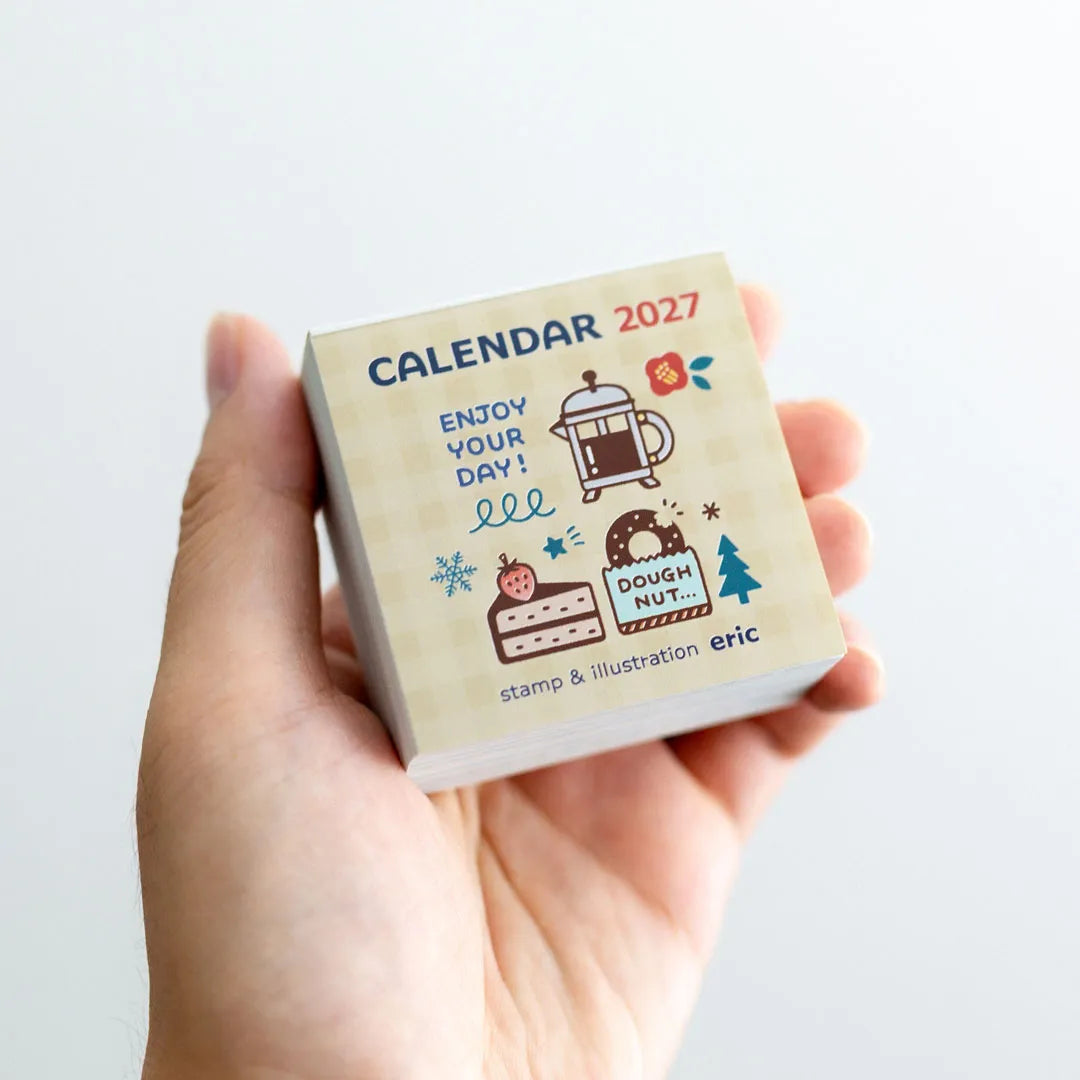 eric Colour Daily Calendar 2027 held in one hand for scale