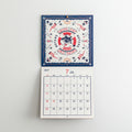 ob1toy LP Wall Calendar 2027 hanging open, artwork above and month below