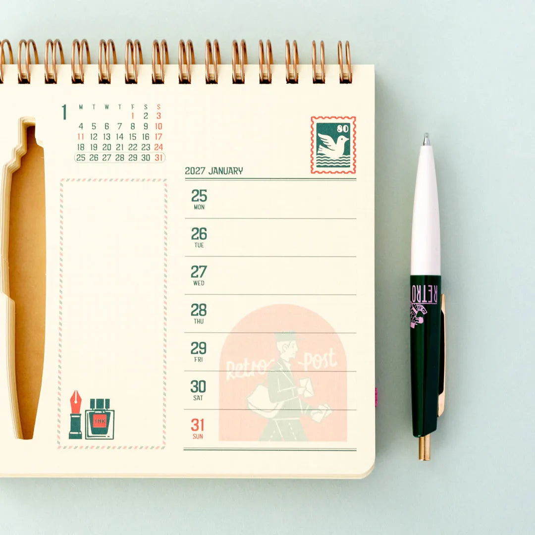 Open weekly page of the ob1toy Weekly Calendar 2027 with the pen alongside