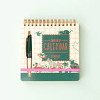 ob1toy Weekly Calendar 2027 closed, with its ballpoint pen held by the elastic band
