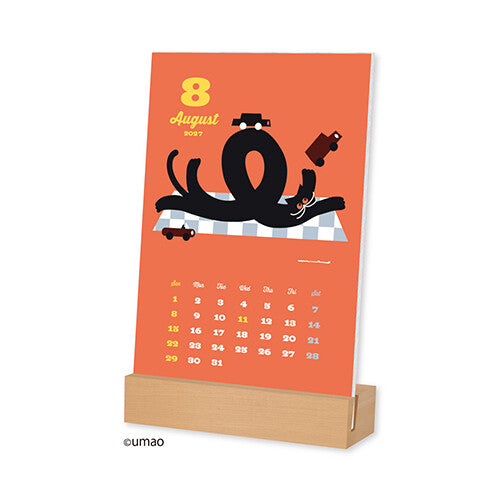 umao Desk Calendar 2027 standing in its wooden base, showing August