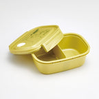 Open mustard yellow My Neighbor Totoro bento box showing interior divider and matte finish