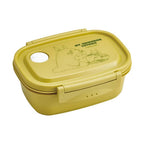 Closed mustard yellow My Neighbor Totoro bento box with green text and matching latch