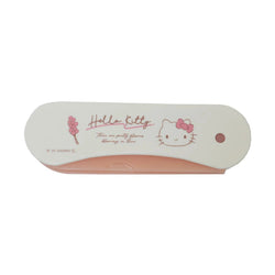 Closed cream Hello Kitty two-way hair comb with pink bow and flower graphic