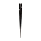 Close-up of black glitter chopsticks with silver cherry blossom design
