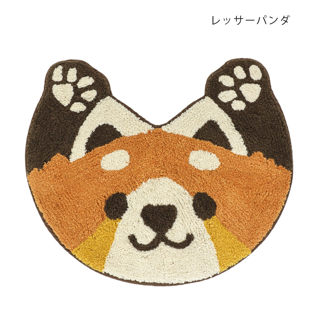 Red panda head shaped tufted cotton mat in rust and cream with dark brown ears