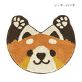 Red panda head shaped tufted cotton mat in rust and cream with dark brown ears
