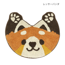 Red panda head shaped tufted cotton mat in rust and cream with dark brown ears