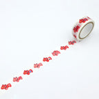 Unrolled red and pink Akabeko tiger pattern on decorative washi tape
