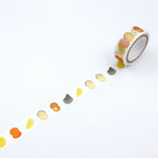 Unrolled kawaii washi tape showing smiling food patterns