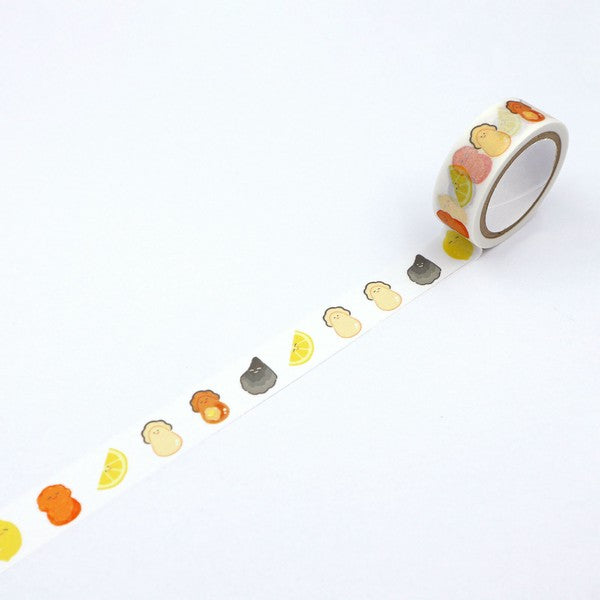 Unrolled kawaii washi tape showing smiling food patterns