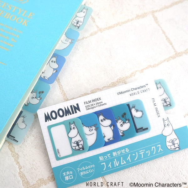 Blue Moomin film index tabs on notebook edge with packaging card