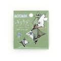 Packaged Moomin clear flake stickers on sage green backing card