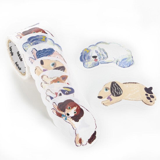 Unspooled roll of die-cut dog stickers showing illustrated breeds on white background