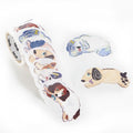 Unspooled roll of die-cut dog stickers showing illustrated breeds on white background