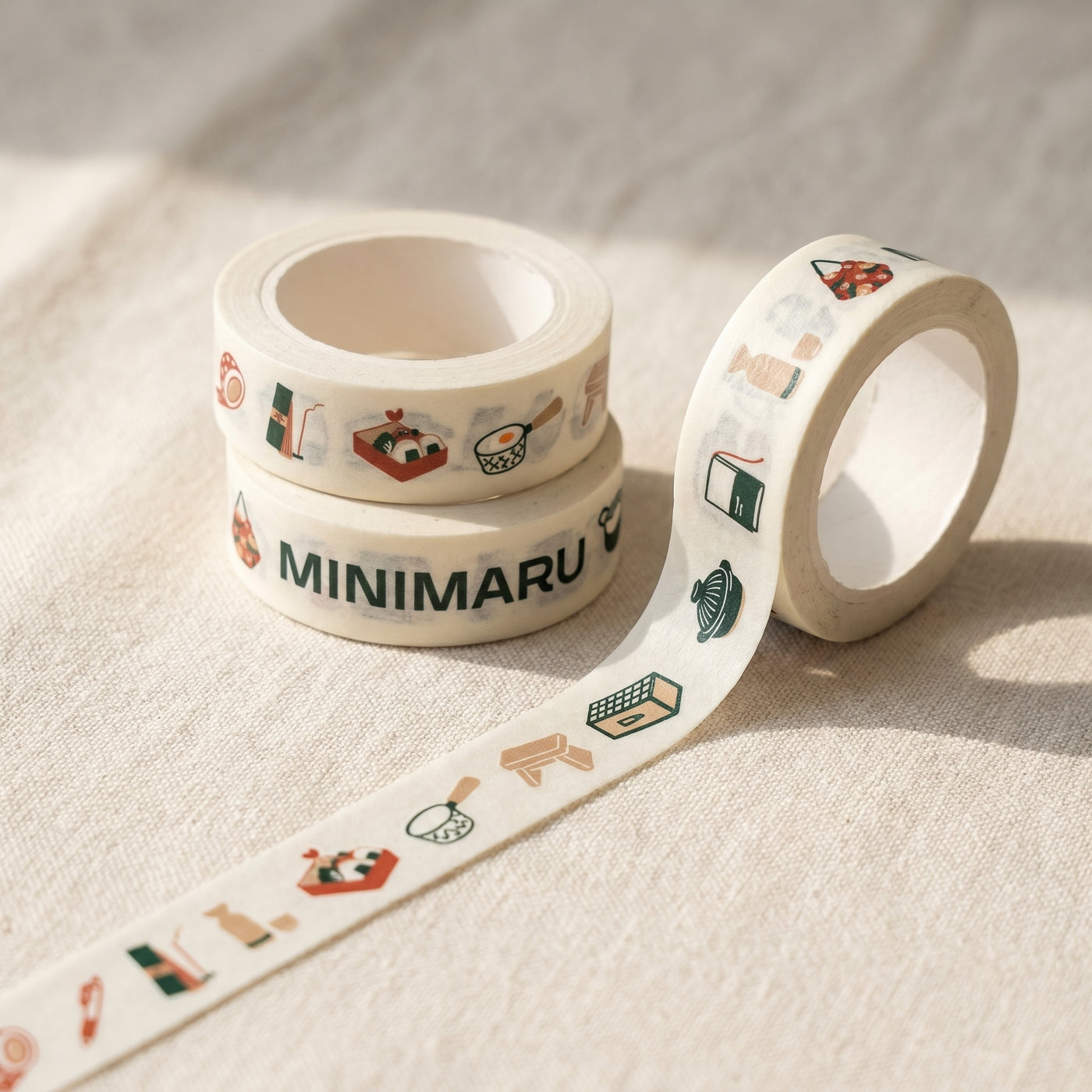 Limited-edition Minimaru anniversary washi tape with illustrated icons of rice bowls, donabe pots, sushi, ladles and onigiri