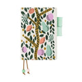Closed Hobonichi Techo 2023 A6 planner featuring full-coverage Eri Shimatsuka tree design with elastic band
