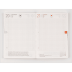 Hobonichi Techo A6 planner open showing grid-lined Tomoe River paper pages for May 20 and 21