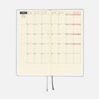 Open light blue Hobonichi Techo 2023 spread with weekly calendar and graph paper