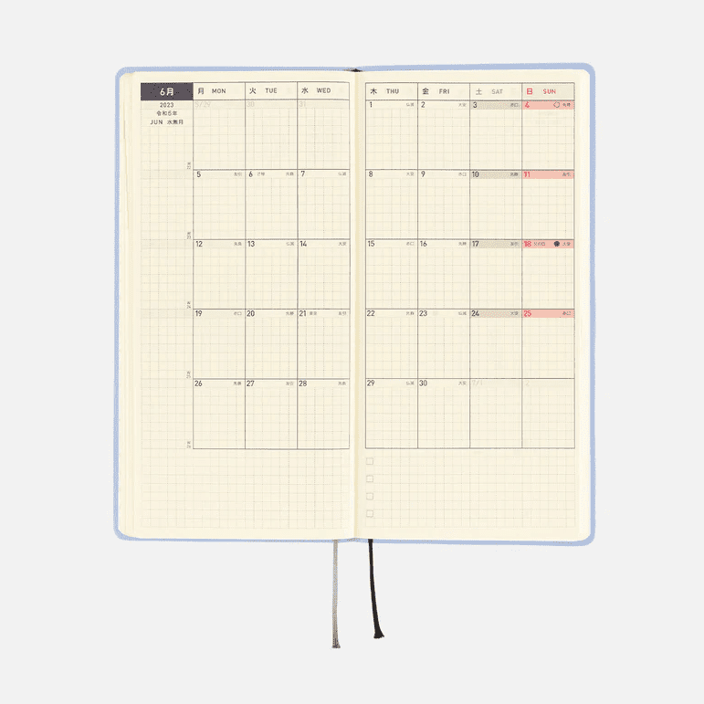 Open light blue Hobonichi Techo 2023 spread with weekly calendar and graph paper