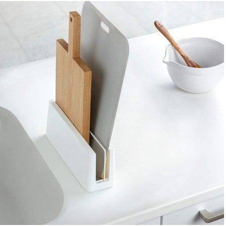 Ishigaki diatomaceous earth kitchen board stand holding wood and grey cutting boards