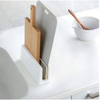 Ishigaki diatomaceous earth kitchen board stand holding wood and grey cutting boards