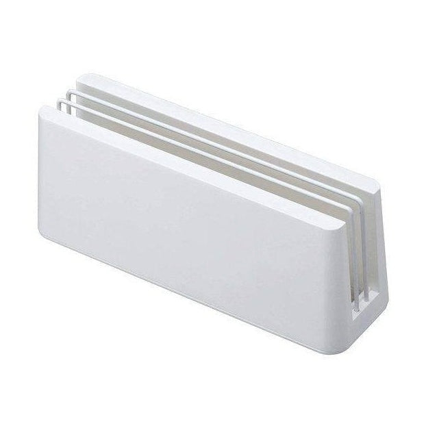 Angled view of white diatomaceous earth board stand showing three parallel slots