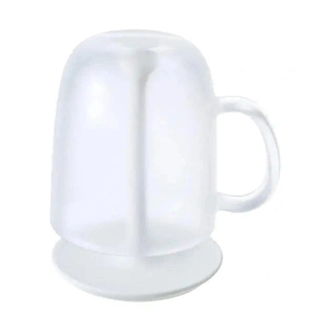 Close-up of white bathroom cup with handle resting on stand
