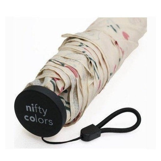 Folded beige floral mini umbrella with nifty colors logo and wrist strap