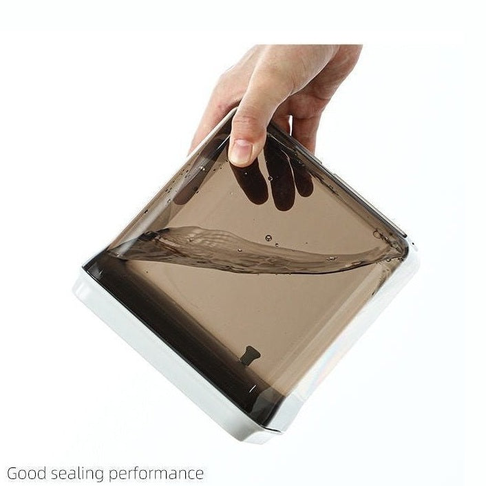 Leak-proof brown airtight kitchen container tilted to show liquid sealing performance