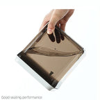 Leak-proof brown airtight kitchen container tilted to show liquid sealing performance