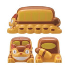 Multi-angle view of yellow and brown Studio Ghibli Cat Bus bento container