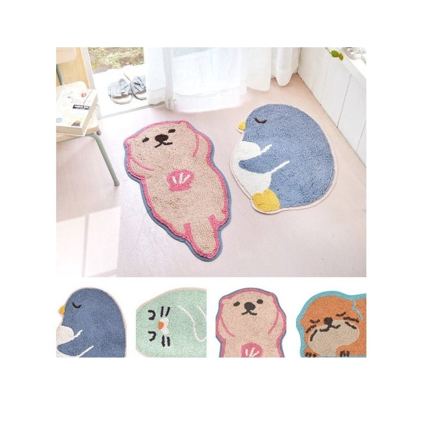 Tomo sea animal mats set featuring pastel penguin and otter plush rugs on wood floor